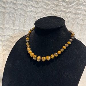 Faceted Tigers Eye graduated round beaded, .925
Sterling Silver 18 inch necklace